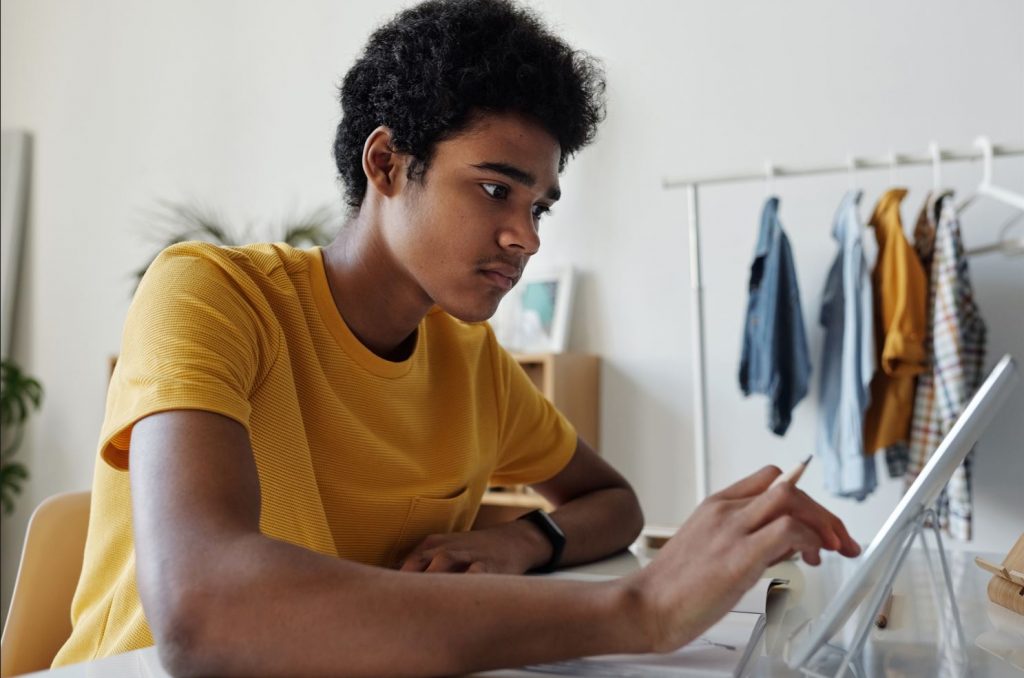 A young person using a tablet