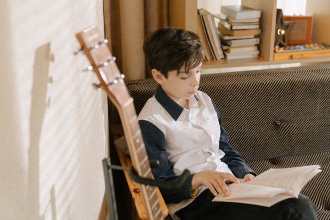 Picture of a boy reading.