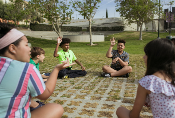 Group of children sitting in a park