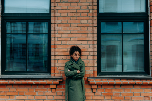 picture of a young woman standing alone