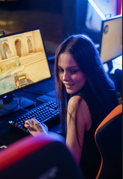 Girl sitting on a gaming chair in front of a video game