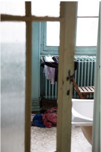 peak into a room with a cloth drying rack