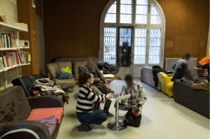 People in the common room during a photo workshop.