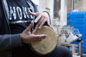 Hands playing a darbouka