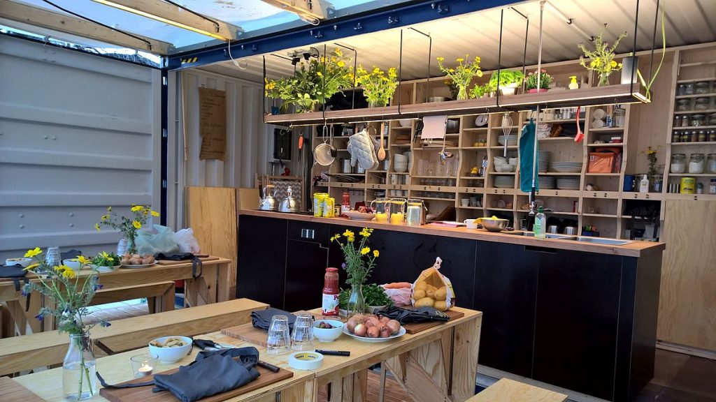 The kitchen space inside the container is designed to be welcoming and easy to navigate. Credit: Über den Tellerrand