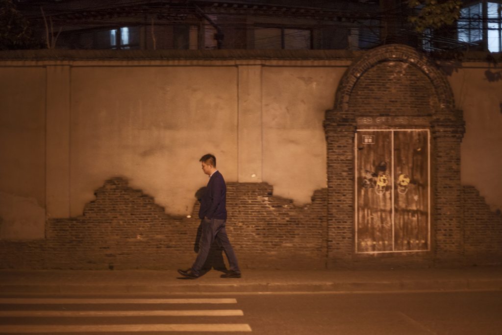 lonely man walking in China