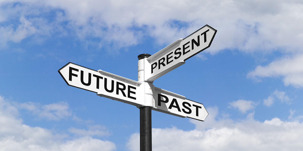 Concept image of a Future Past Present signpost against a blue cloudy sky